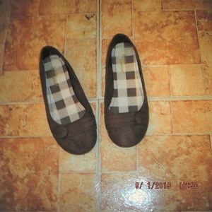 Brown Flats with decorative button.